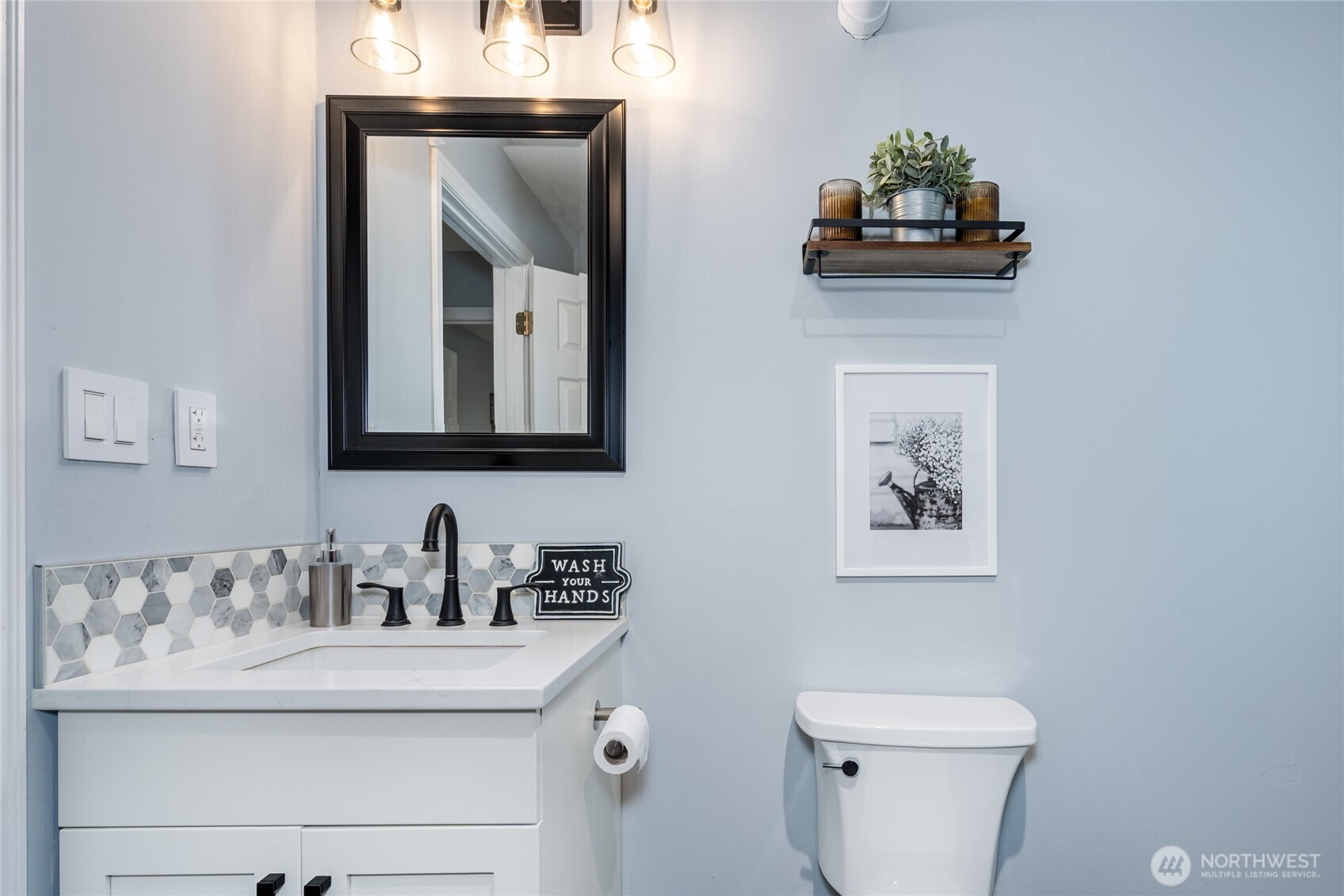 3113 198th Place Southeast Bothell, WA 98012 - Photo 20 of 32 a bathroom with a toilet a sink and mirror