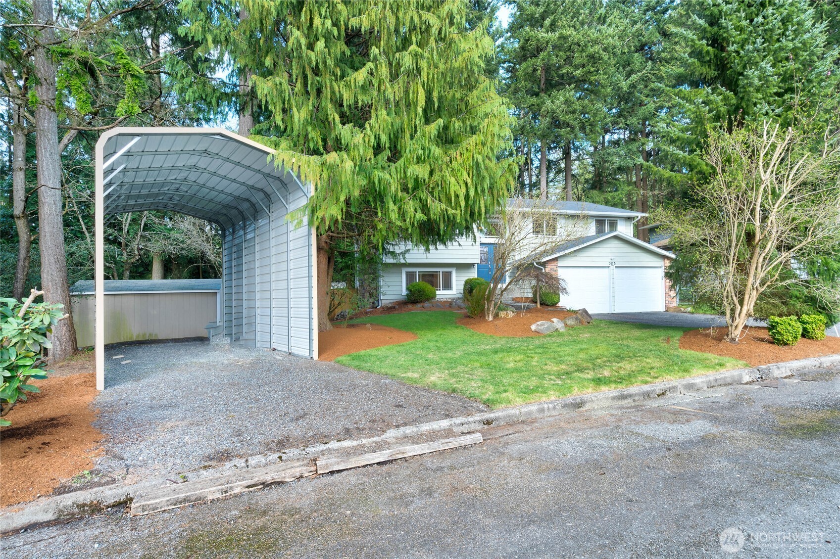 3113 198th Place Southeast Bothell, WA 98012 - Photo 31 of 32 a view of a house with backyard and garden