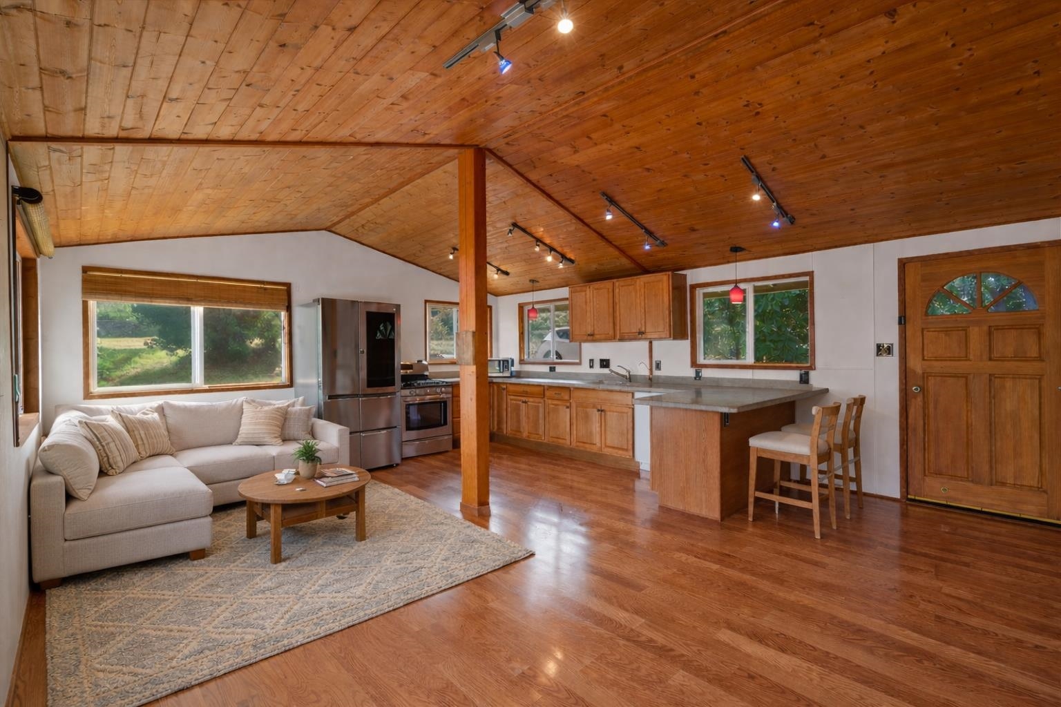 31 Hapapa Road, Unit B Kula, HI 96790 - Photo 7 of 50 a living room with furniture and kitchen view with wooden floor