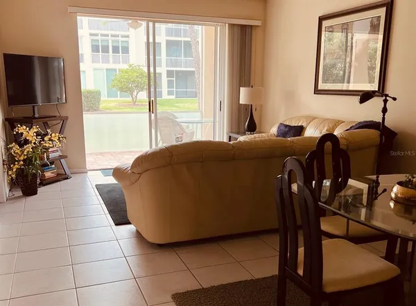 a living room with furniture and a window