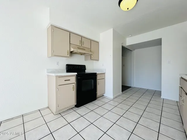 a kitchen with stainless steel appliances a sink and cabinets