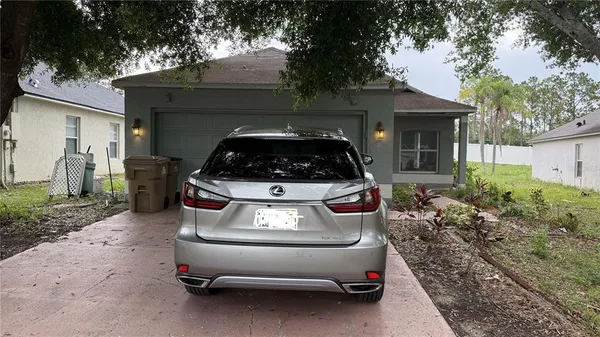 a car parked in front of a house