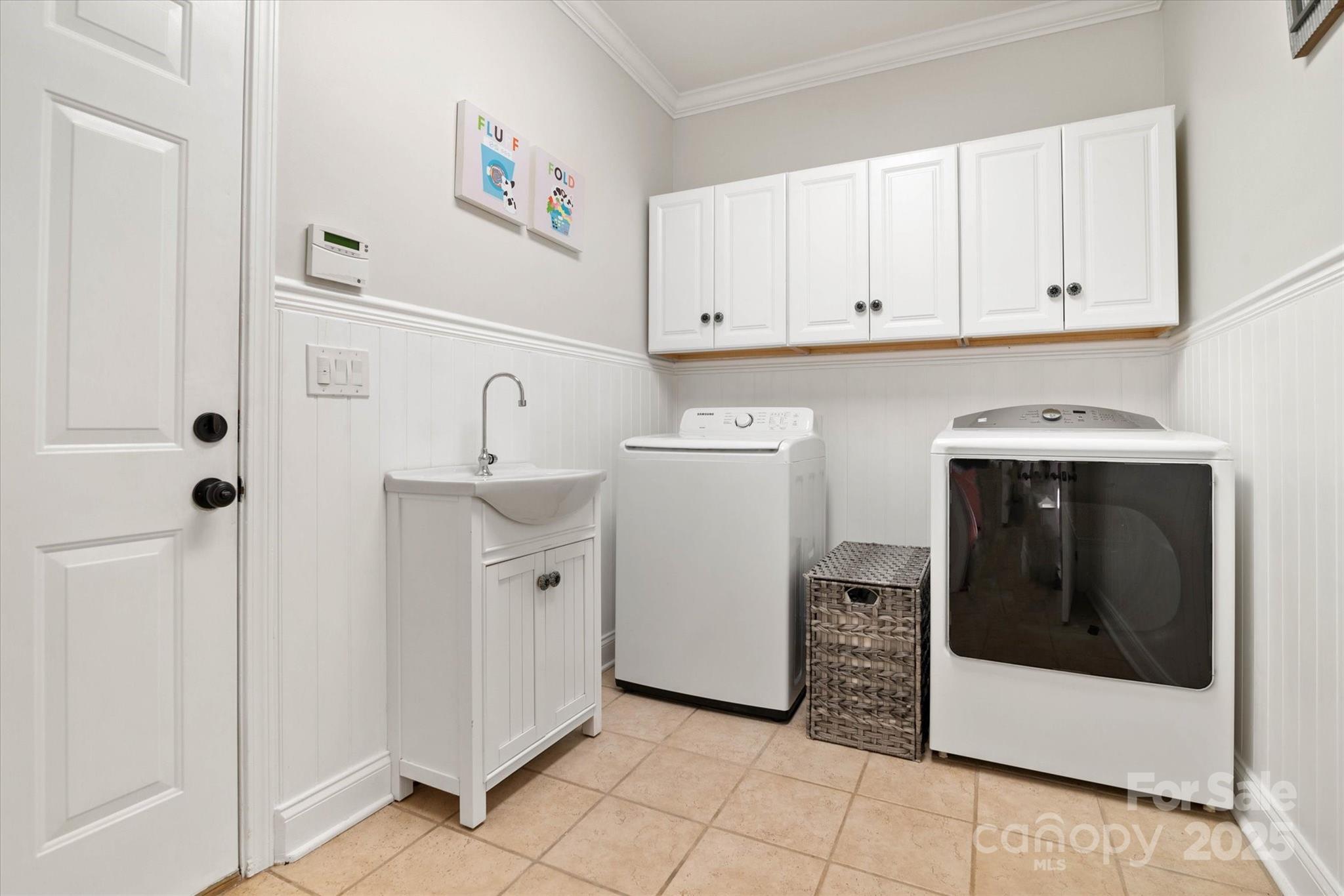 1421 Ashford Road Chester, SC 29706 - Photo 17 of 48 a utility room with cabinets washer and dryer