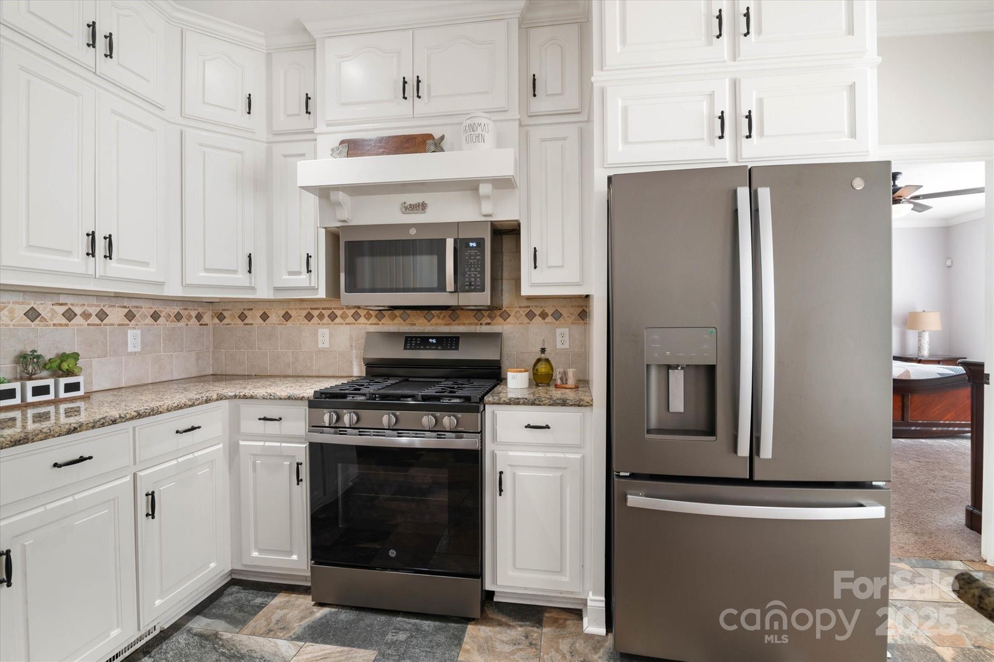 1421 Ashford Road Chester, SC 29706 - Photo 19 of 48 a kitchen with cabinets stainless steel appliances and a counter space