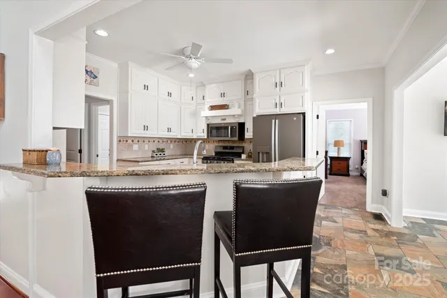 a bedroom with a bed dresser and a window