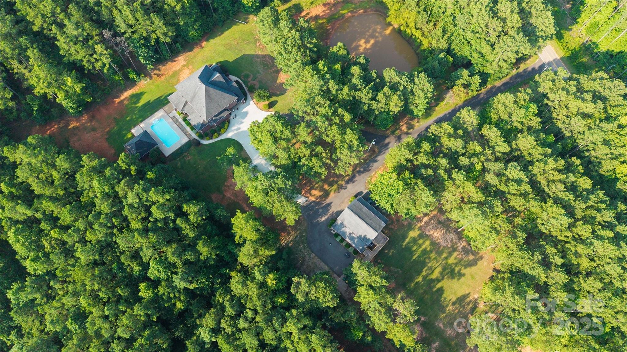 1421 Ashford Road Chester, SC 29706 - Photo 3 of 48 an aerial view of a house with a yard and trees