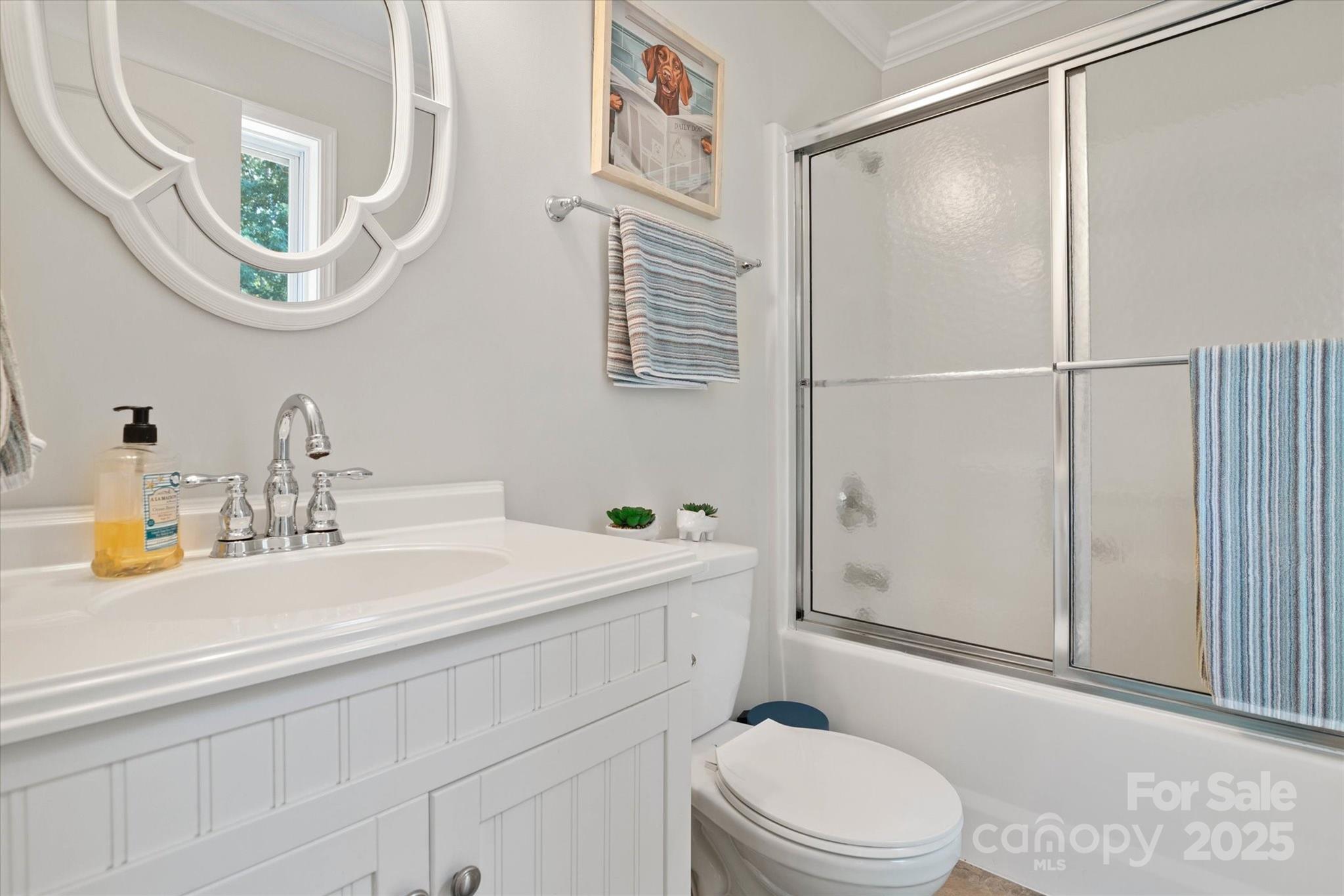 1421 Ashford Road Chester, SC 29706 - Photo 33 of 48 a bathroom with a sink a toilet and a mirror