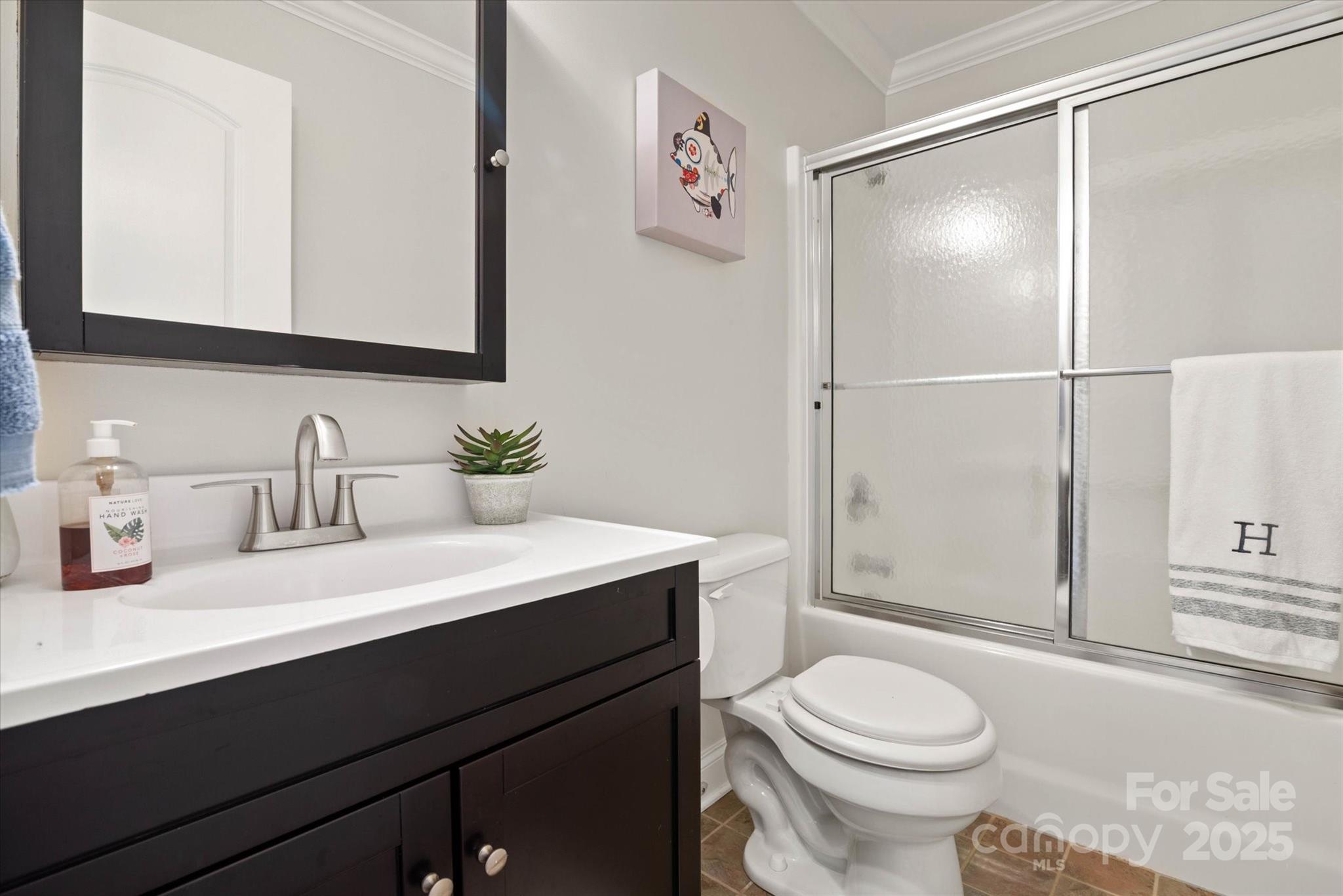 1421 Ashford Road Chester, SC 29706 - Photo 34 of 48 a bathroom with a sink a toilet and shower