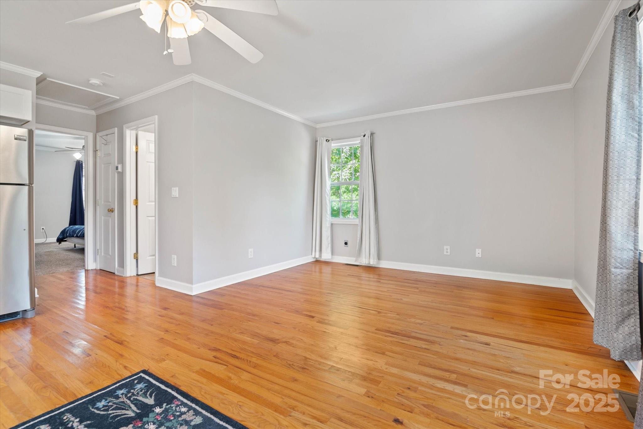 1421 Ashford Road Chester, SC 29706 - Photo 42 of 48 a view of an empty room with wooden floor and a window