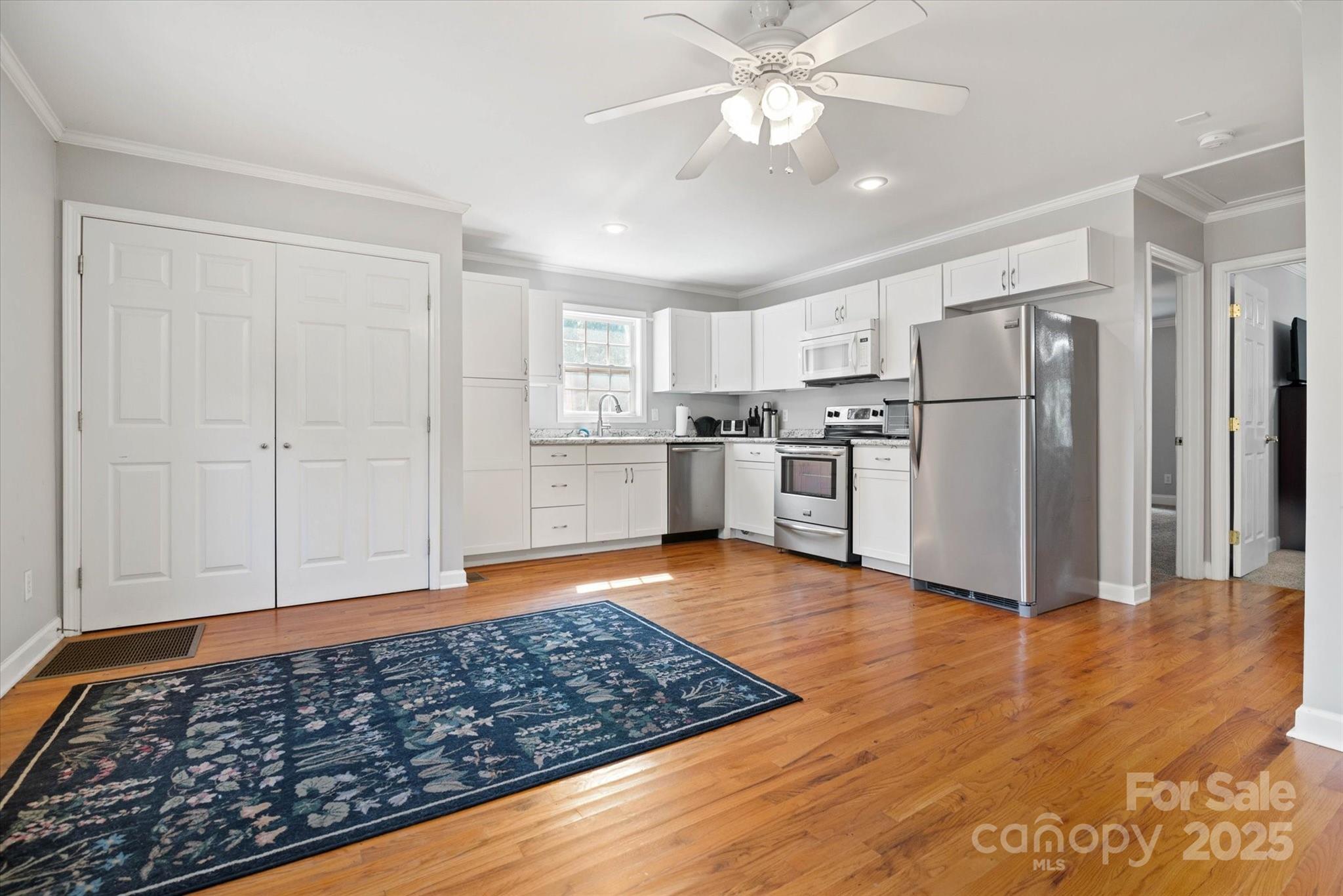 1421 Ashford Road Chester, SC 29706 - Photo 43 of 48 a view of a kitchen with wooden floor electronic appliances and cabinets