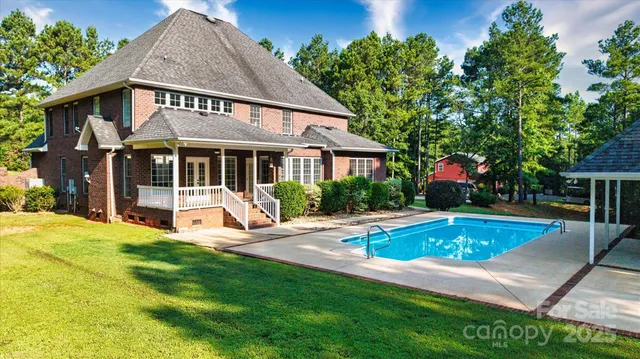 a view of a house with a swimming pool