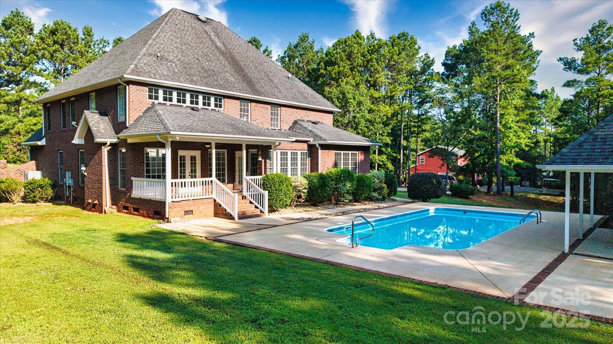 1421 Ashford Road Chester, SC 29706 - Photo 6 of 48 a view of swimming pool with lawn chairs and plants