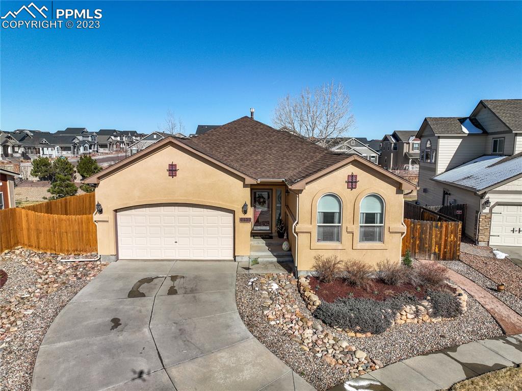 6435 Coyote Ridge Court Colorado Springs, CO 80923 - Photo 1 of 50 a view of a house with a outdoor space