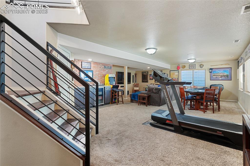 6435 Coyote Ridge Court Colorado Springs, CO 80923 - Photo 31 of 50 a view of a room with gym equipment