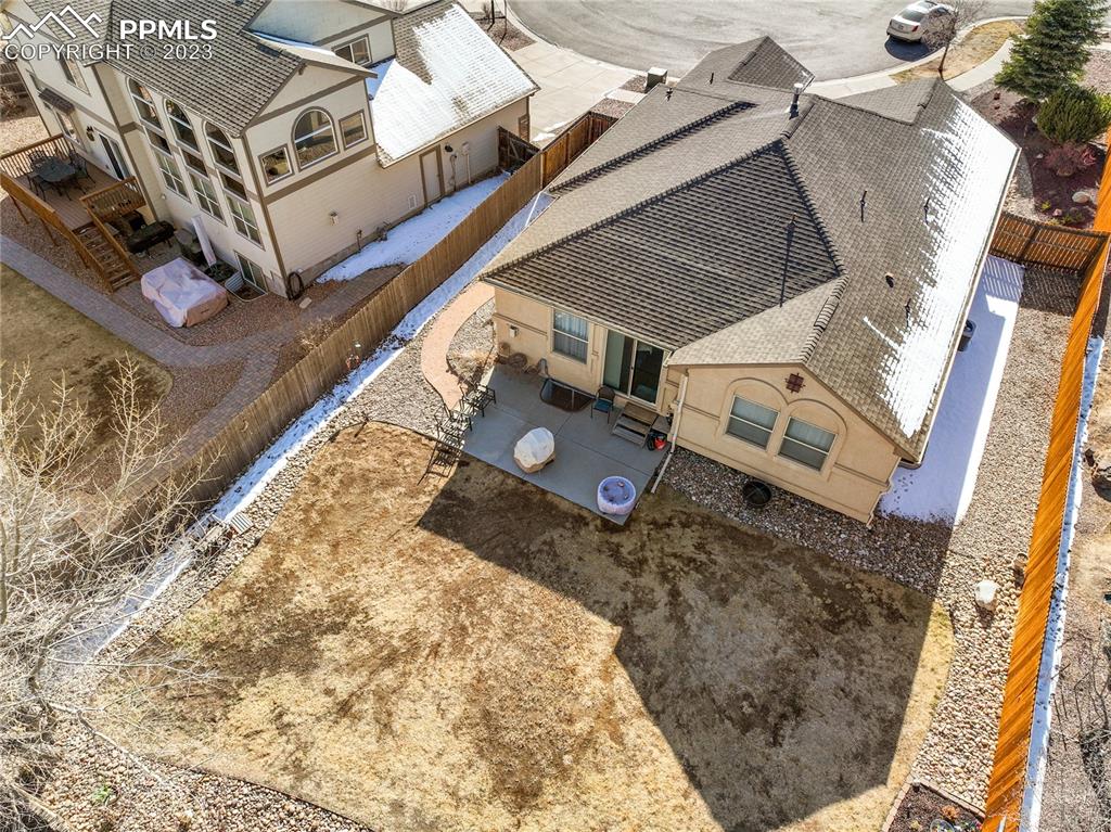 6435 Coyote Ridge Court Colorado Springs, CO 80923 - Photo 49 of 50 front view of a house with a yard