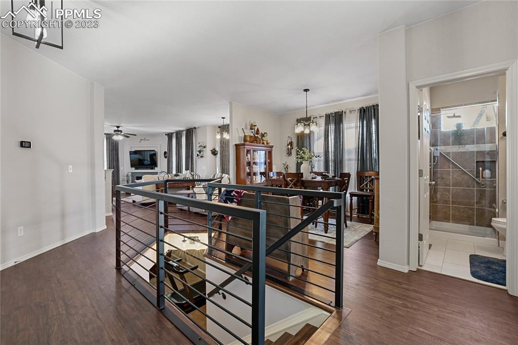 6435 Coyote Ridge Court Colorado Springs, CO 80923 - Photo 5 of 50 a view of a dining room kitchen and a wooden floor