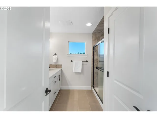 a bathroom with a sink and a shower