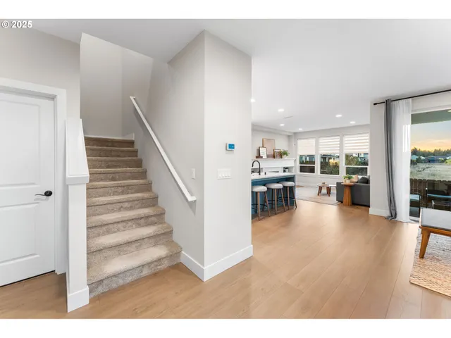 a view of a living room and kitchen with furniture