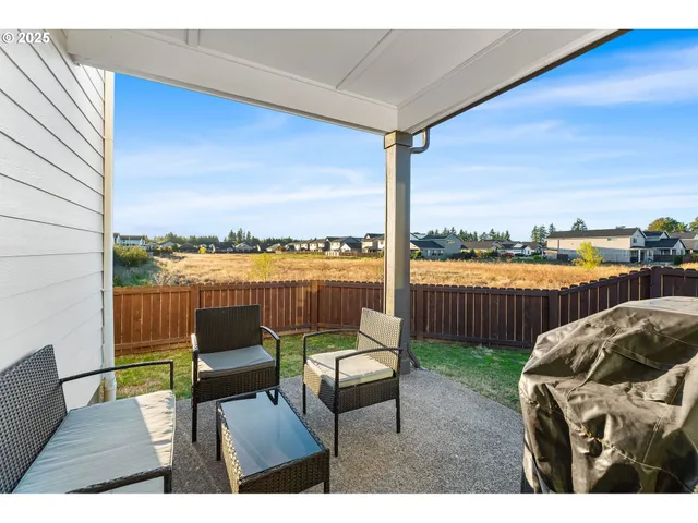a balcony with furniture and city view