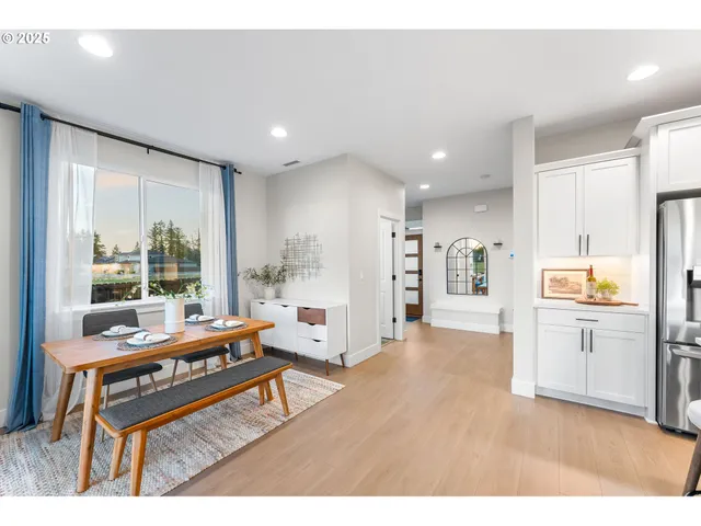 a living room with stainless steel appliances kitchen island granite countertop furniture and a kitchen view