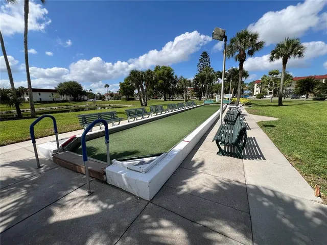 a view of a bench in a park
