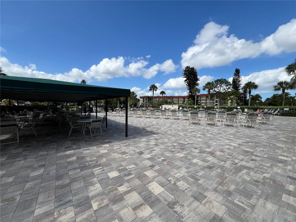 4186 27th Court Southwest, Unit 105 Naples, FL 34116 - Photo 10 of 14 a view of a terrace with dining space