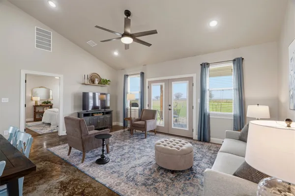 a living room with furniture and a large window