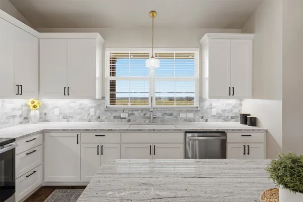 a kitchen with a sink and cabinets