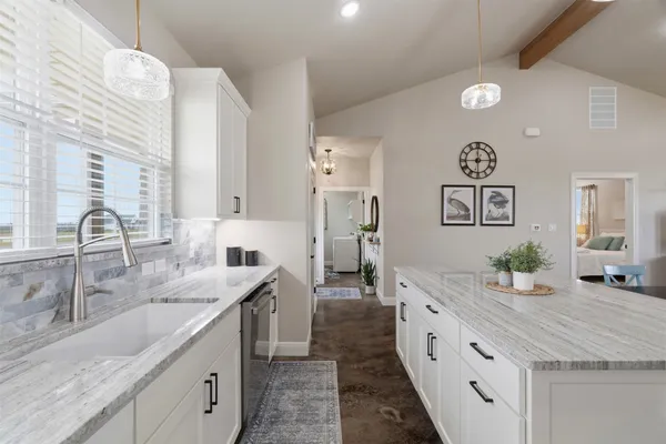 a large bathroom with double vanity and a mirror