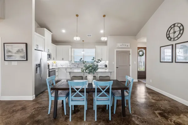 a view of a dining room with furniture