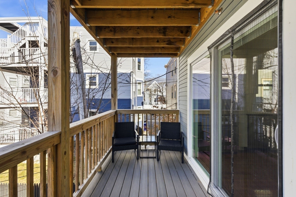 567 Park Street, Unit 2 Boston, MA 02124 - Photo 16 of 20 a view of balcony with wooden floor