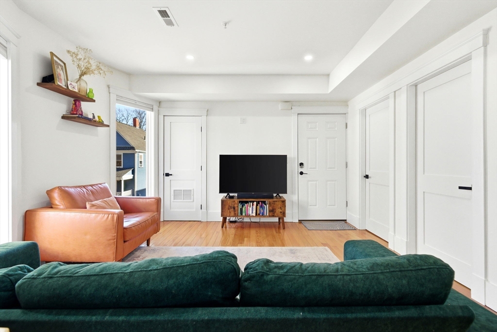 567 Park Street, Unit 2 Boston, MA 02124 - Photo 6 of 20 a living room with furniture and a flat screen tv
