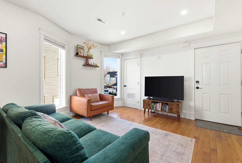 567 Park Street, Unit 2 Boston, MA 02124 - Photo 7 of 20 a living room with furniture and a flat screen tv