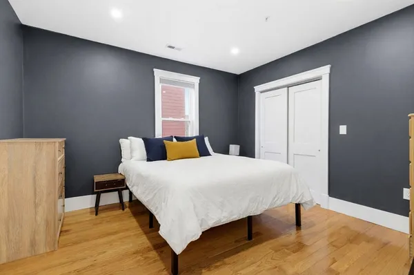 a bedroom with a bed and a table