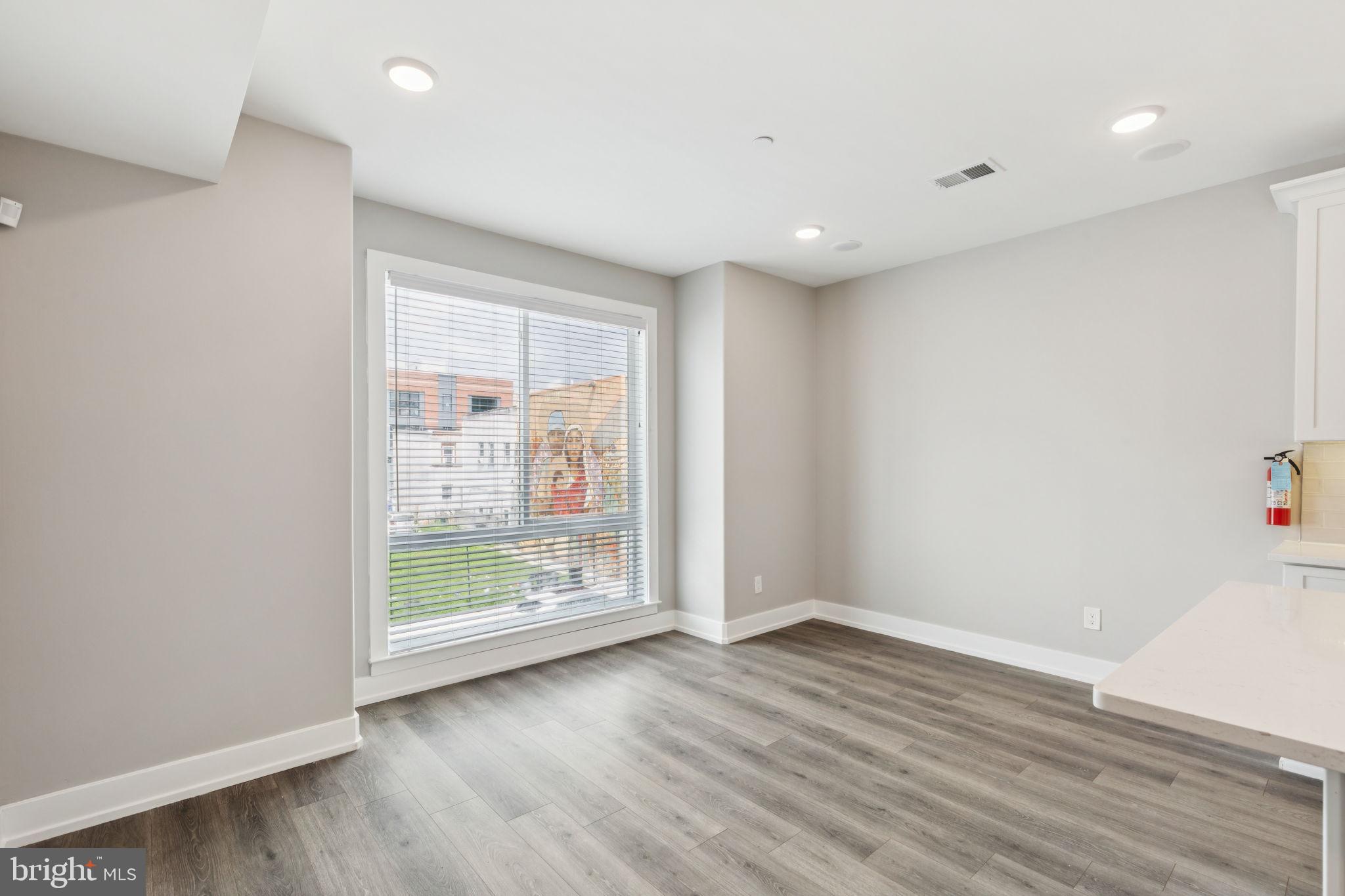 2531 North Front Street, Unit 2 Philadelphia, PA 19133 - Photo 11 of 25 wooden floor in an empty room with a window