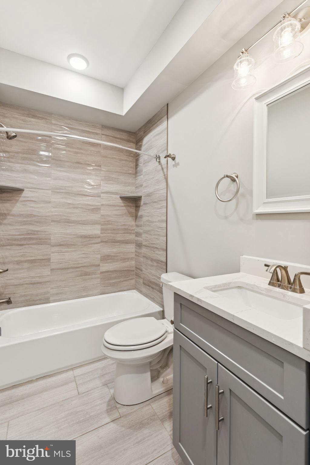 2531 North Front Street, Unit 2 Philadelphia, PA 19133 - Photo 19 of 25 a bathroom with a sink a toilet and shower