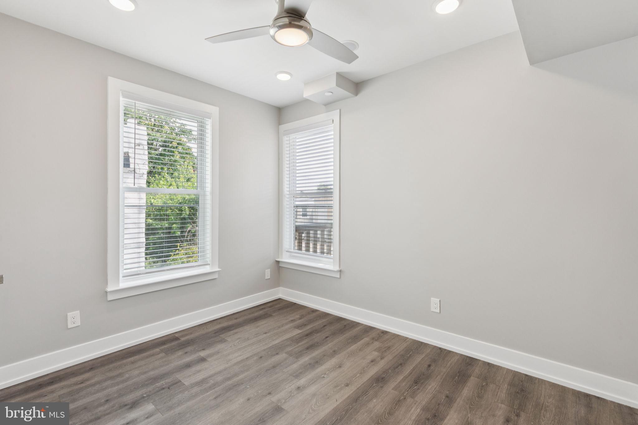 2531 North Front Street, Unit 2 Philadelphia, PA 19133 - Photo 20 of 25 a view of an empty room with wooden floor and a window