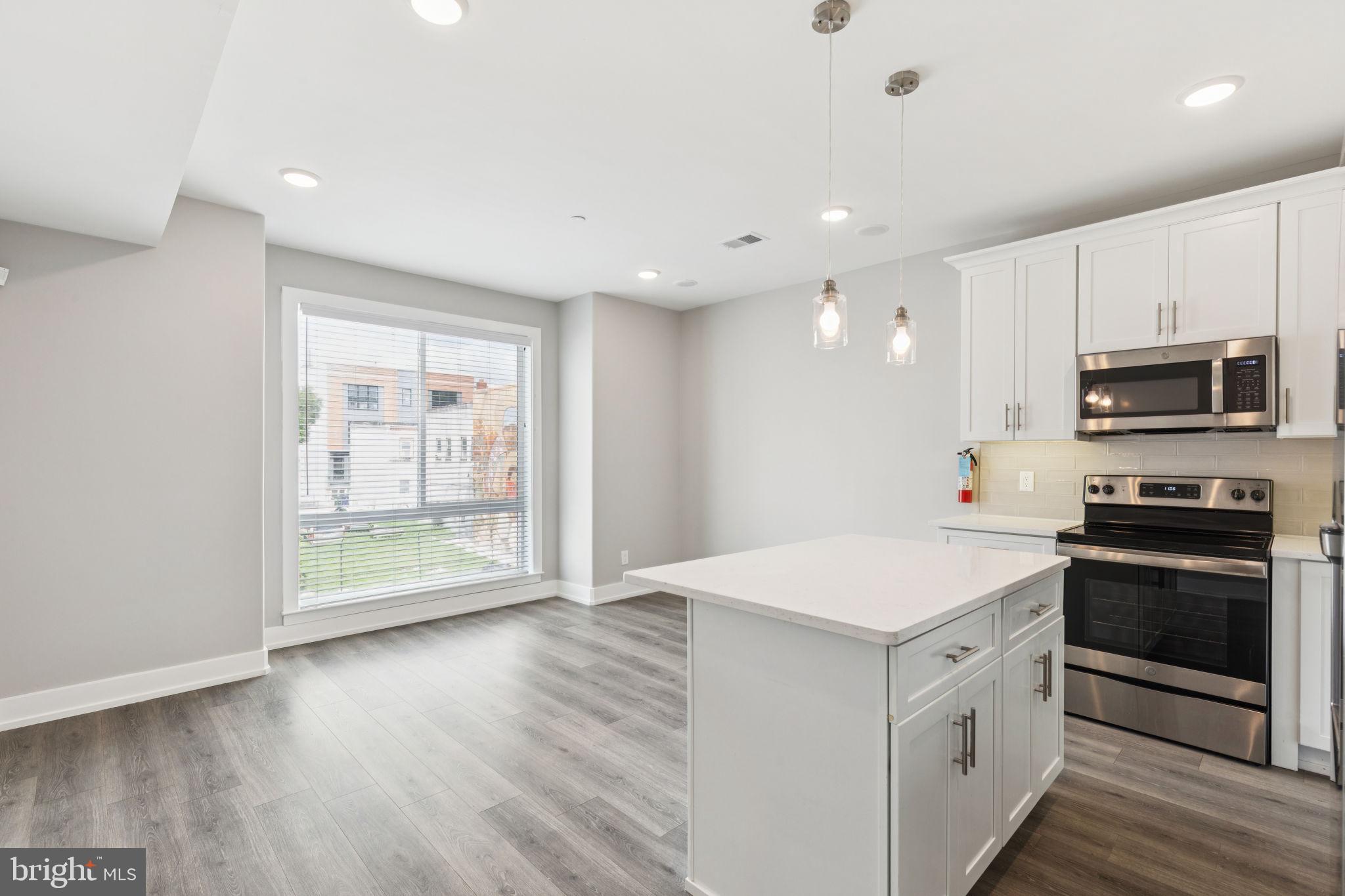 2531 North Front Street, Unit 2 Philadelphia, PA 19133 - Photo 3 of 25 a kitchen with stove cabinets and stainless steel appliances