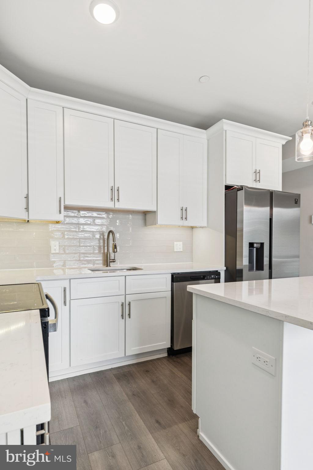 2531 North Front Street, Unit 2 Philadelphia, PA 19133 - Photo 9 of 25 a kitchen with cabinets appliances a sink and a counter top space