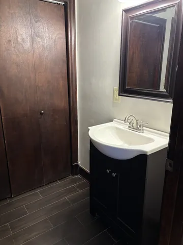 a bathroom with a sink and mirror
