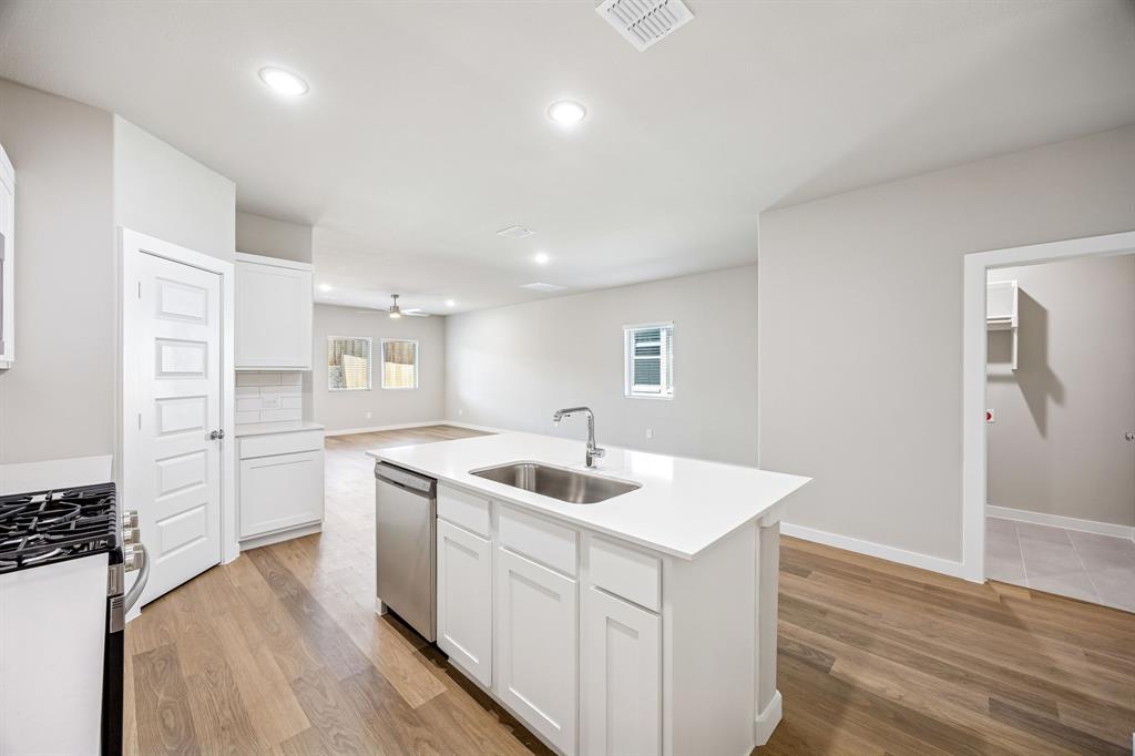 8349 Kingfisher Road Pilot Point, TX 76258 - Photo 11 of 37 Kitchen in the Willow home plan by Trophy Signature Homes – REPRESENTATIVE PHOTO