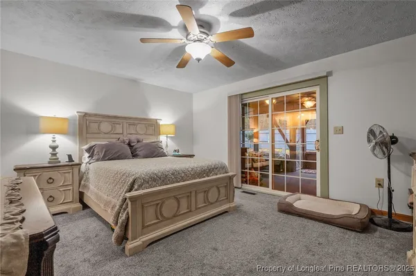 a spacious bedroom with a bed and a window