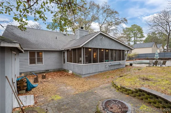 a view of a house with backyard patio and backyard