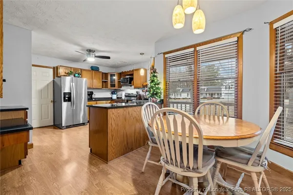 a dining room with furniture and window