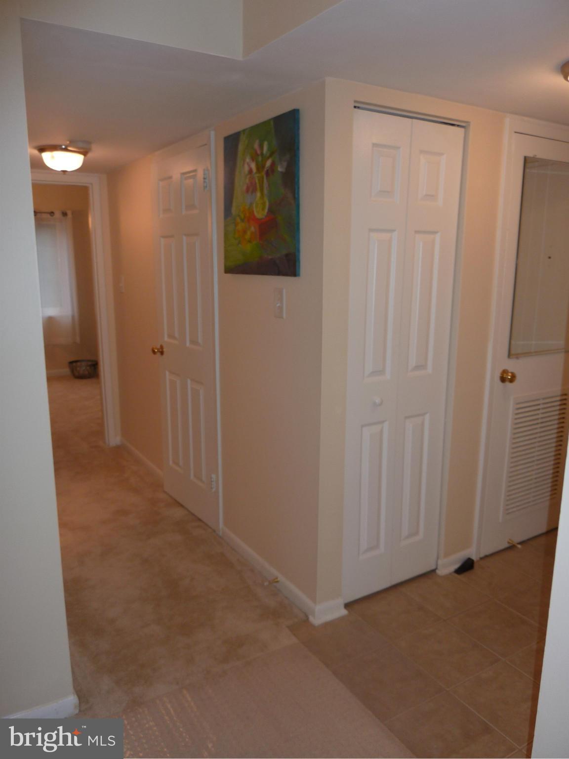 1418 Northgate Square, Unit 12C Reston, VA 20190 - Photo 16 of 19 Foyer and hall to Br 2 and 3