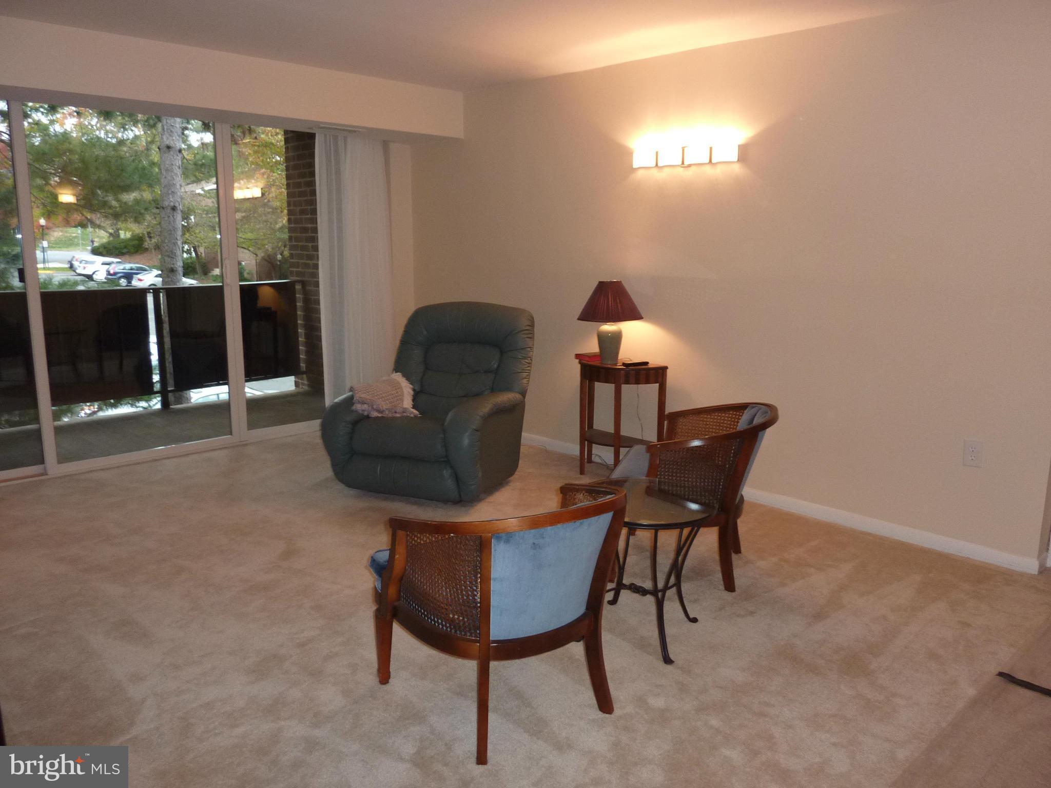 1418 Northgate Square, Unit 12C Reston, VA 20190 - Photo 7 of 19 Living Room has SGD to balcony