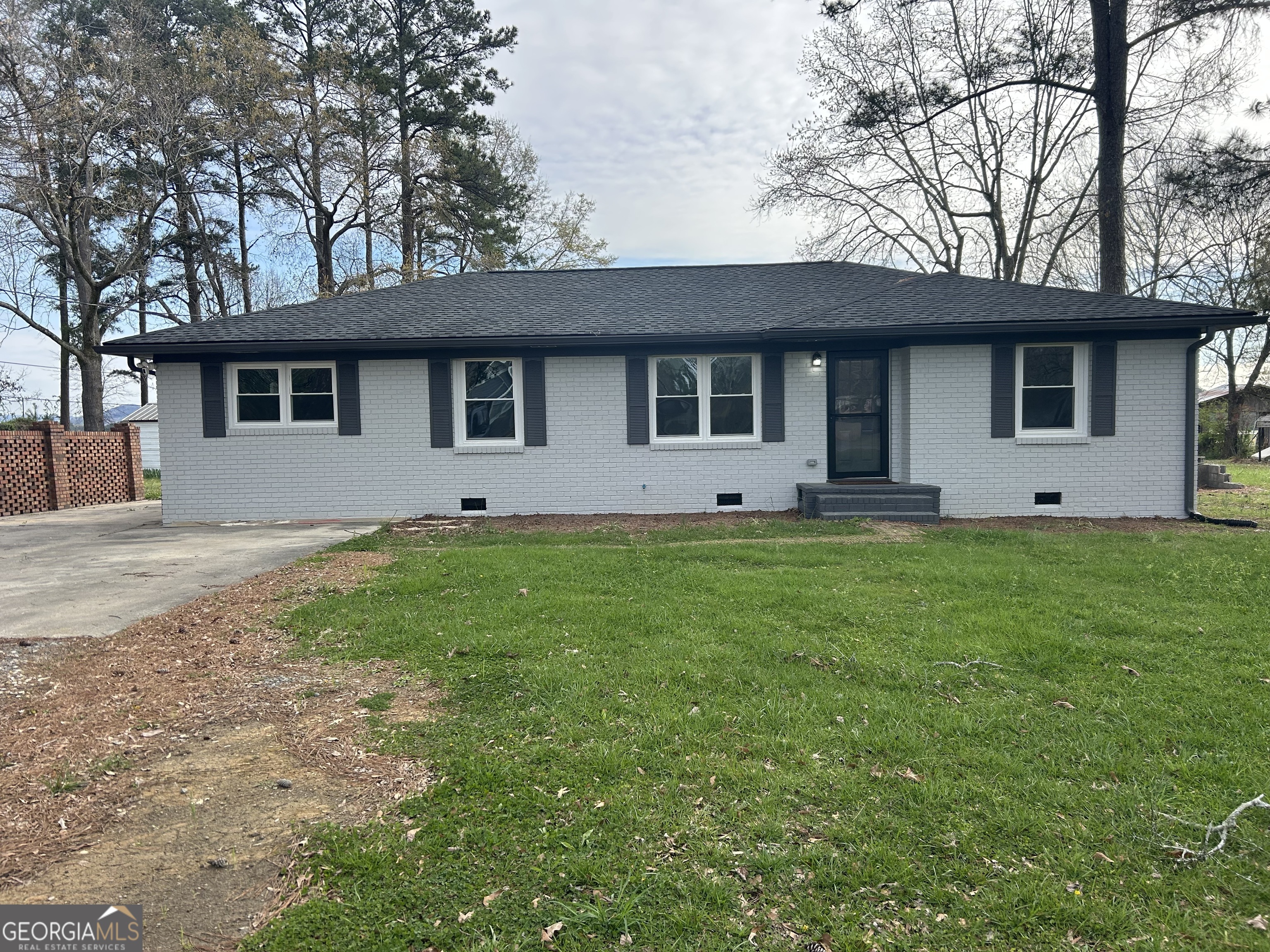 360 Warren Road Northeast Rome, GA 30165 - Photo 1 of 14 a front view of house with yard and trees