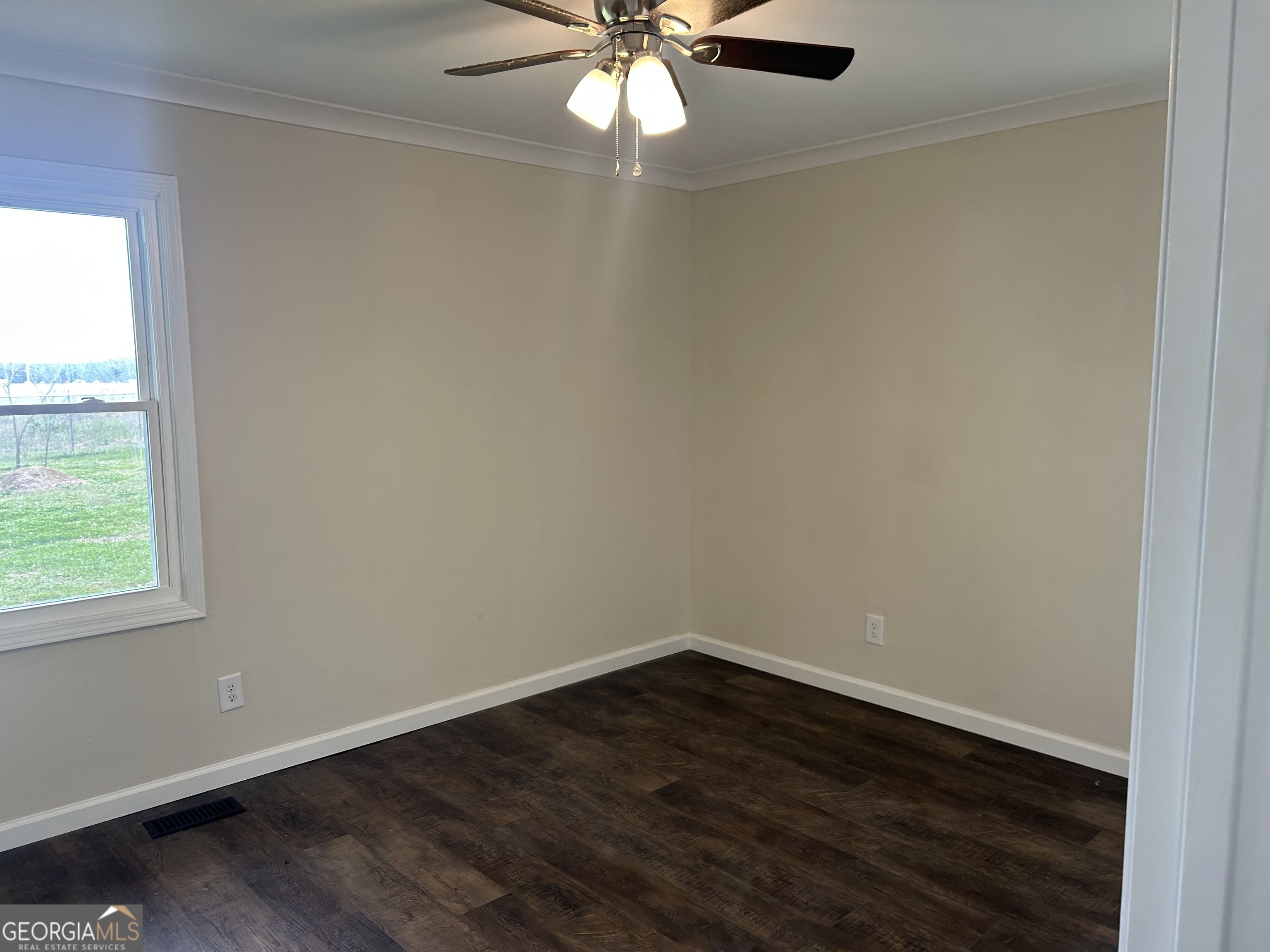 360 Warren Road Northeast Rome, GA 30165 - Photo 11 of 14 an empty room with wooden floor and windows