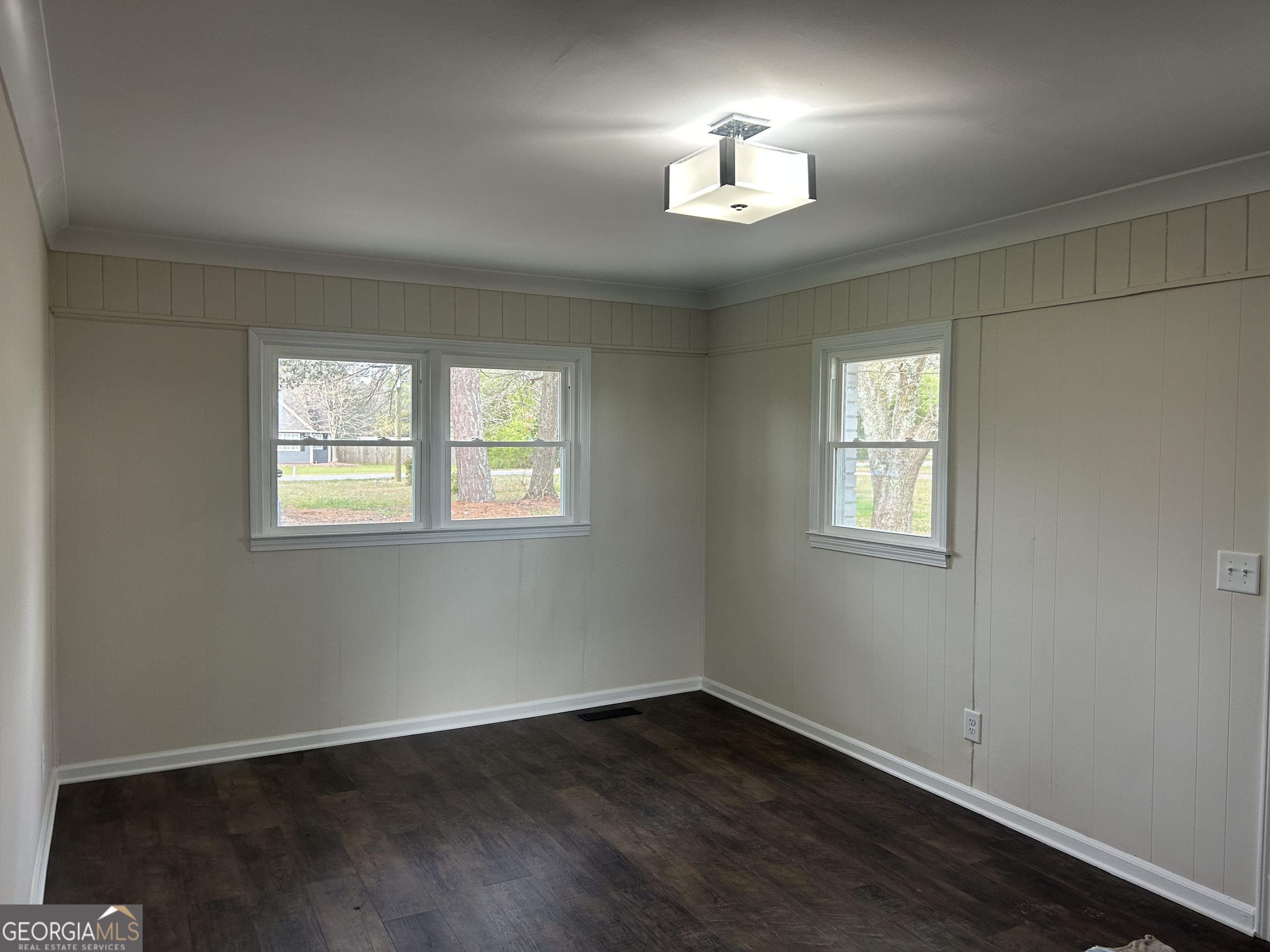 360 Warren Road Northeast Rome, GA 30165 - Photo 2 of 14 a view of an empty room with wooden floor and a window