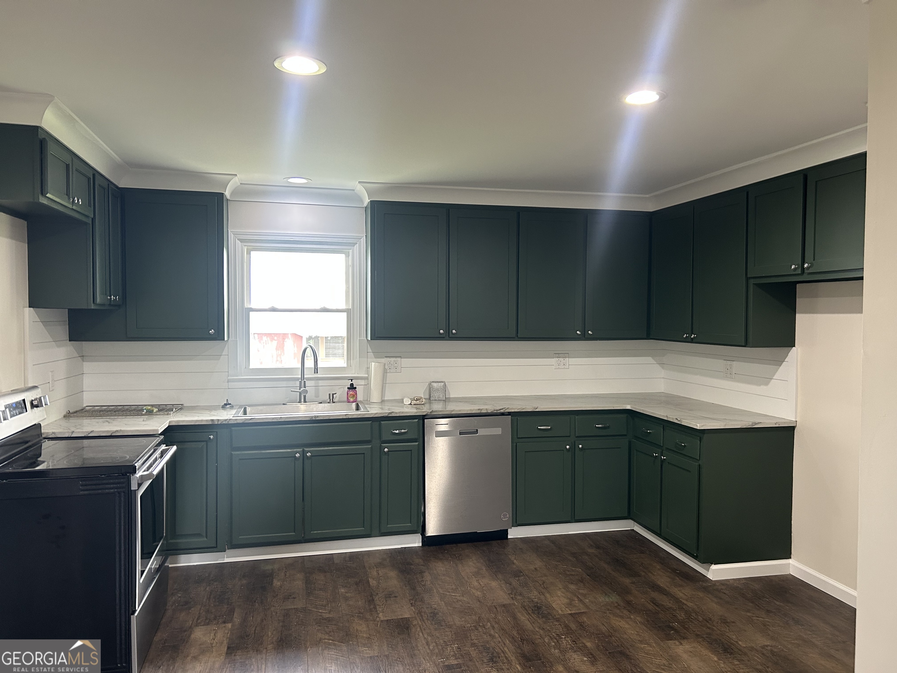 360 Warren Road Northeast Rome, GA 30165 - Photo 4 of 14 a kitchen with a sink and cabinets